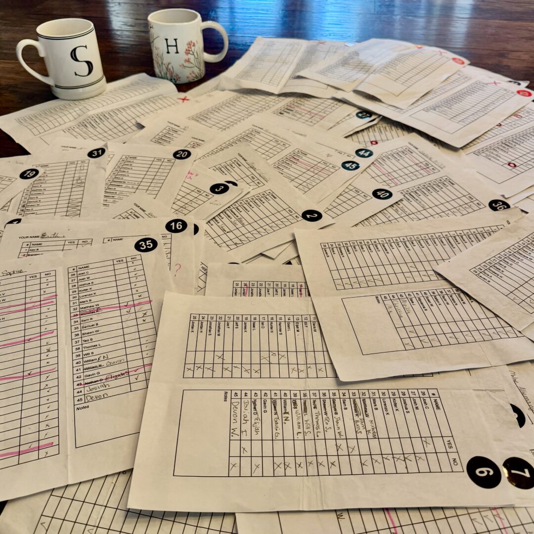 Match sheets spread across our bed at 5 AM